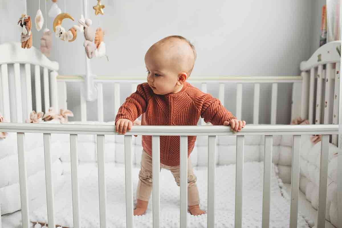 When To Lower Your Baby's Crib According to Experts FamilyEducation